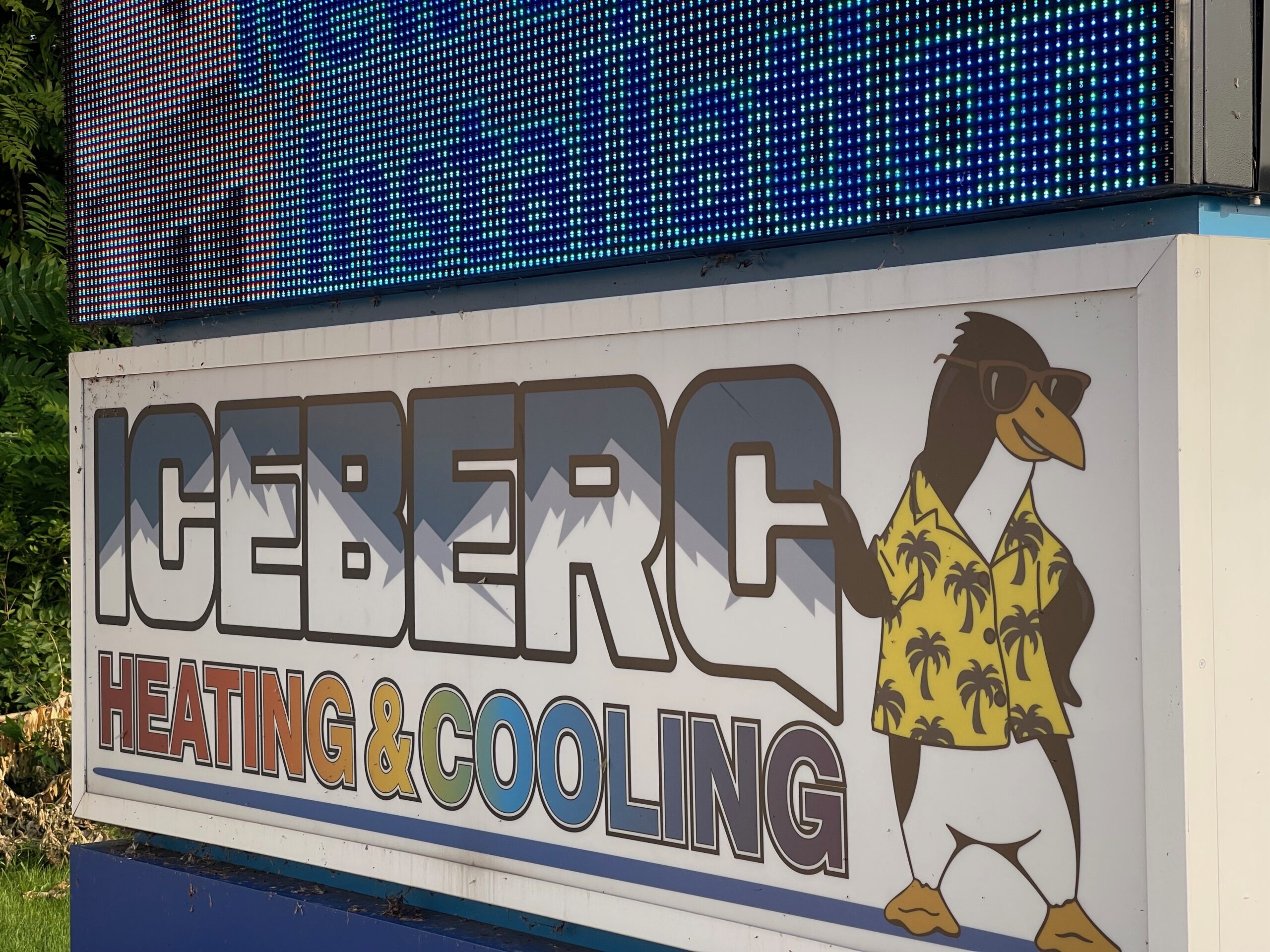 Iceberg billboard showcasing their penguin mascot