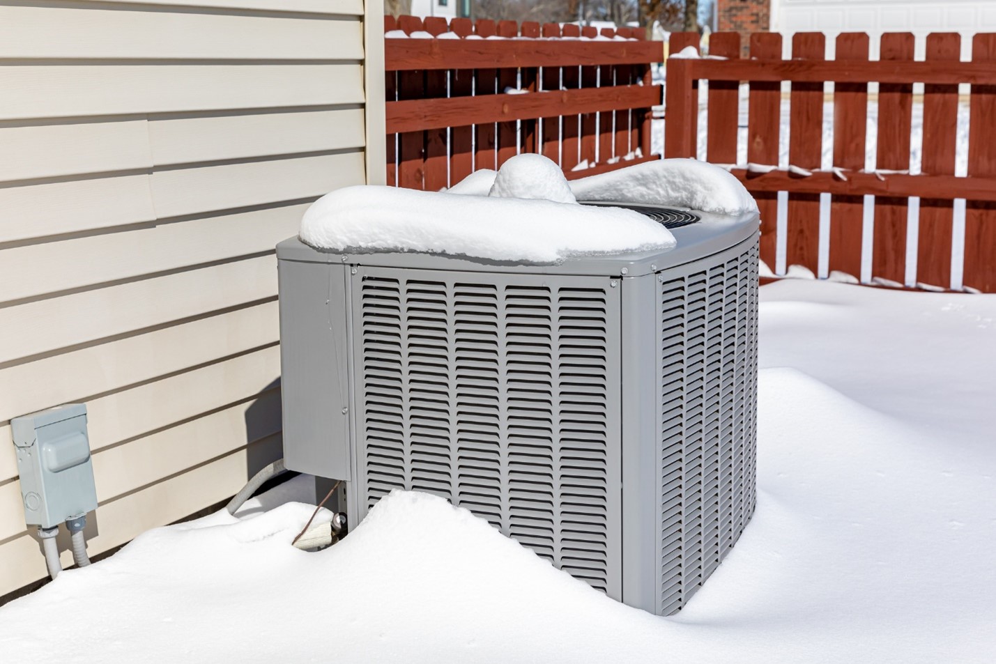 Snow covered AC unit outside