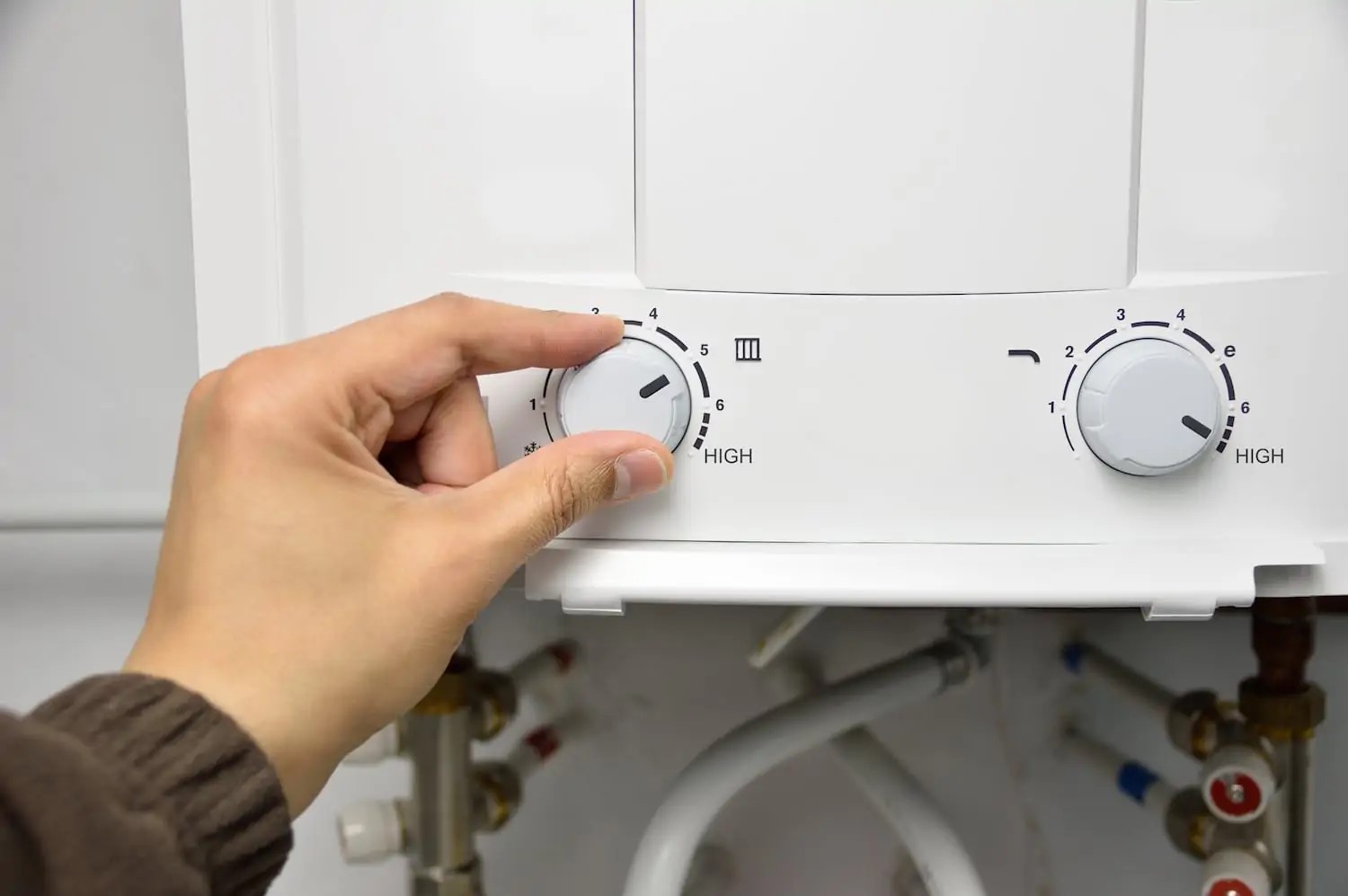 Tankless water heater repair services being completed by a professional